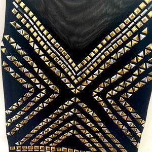 Bebe black short dress with silver and gold studs imbedded. Mesh upper part.